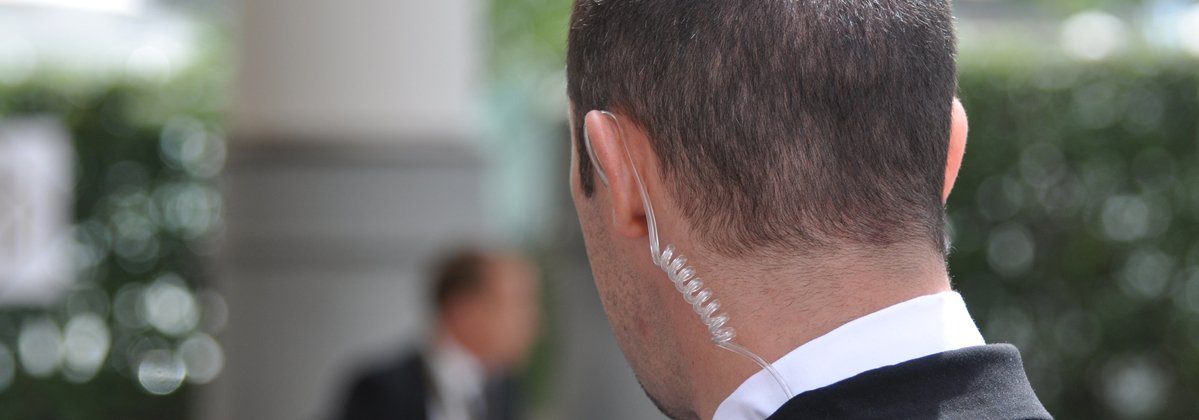 Man, bodyguard, security with earpiece