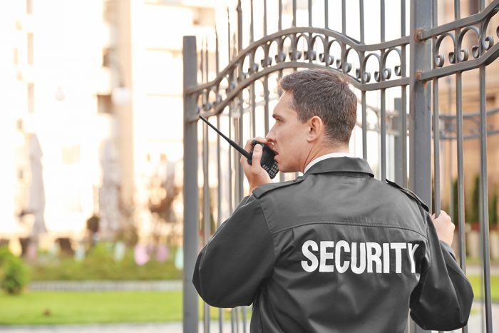 Security Guard talking on radio